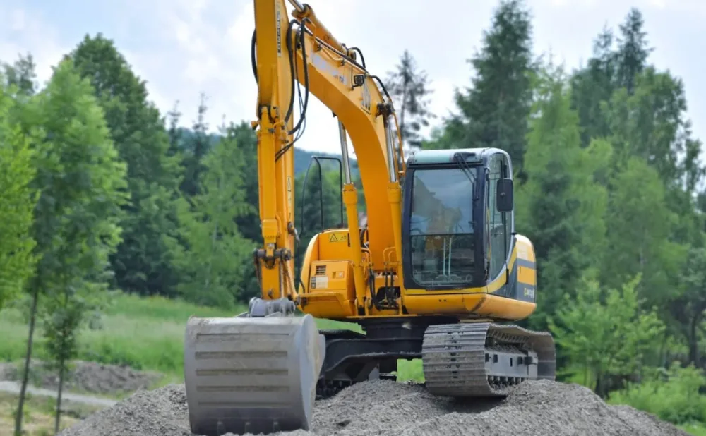 Excavator earthworks and site foundation construction